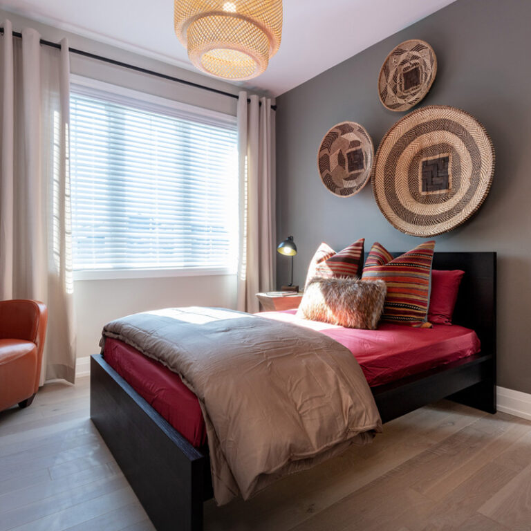 Tan and red bedroom with rattan wicker décor.